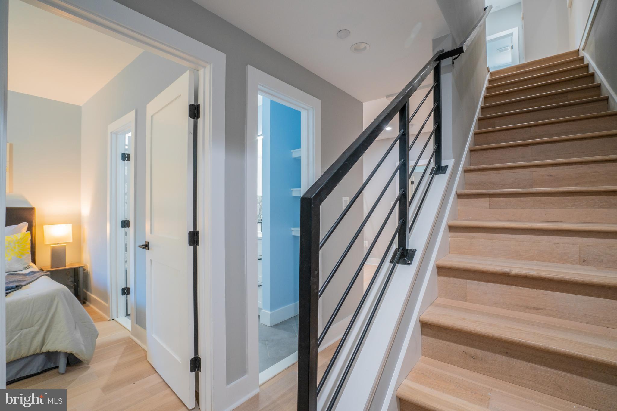 1225 Park Road Northwest, Unit 1 Washington, DC 20010 - Photo 18 of 38 a view of a hallway with wooden floor and stairs