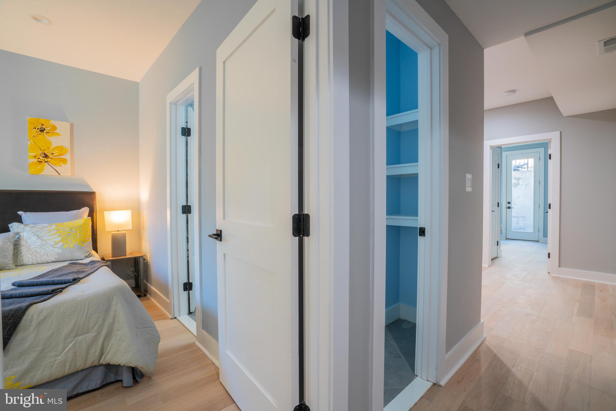 1225 Park Road Northwest, Unit 1 Washington, DC 20010 - Photo 32 of 38 a bedroom with a bed and a walk in closet