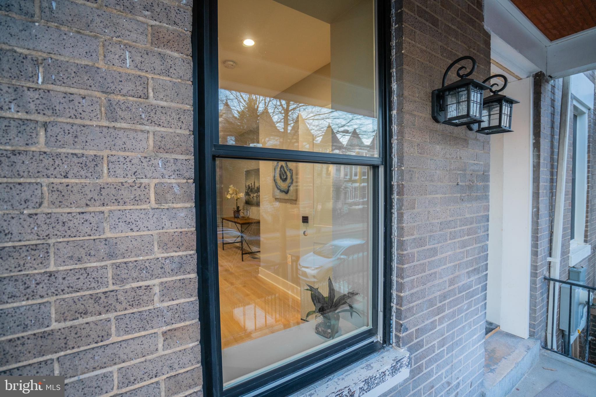 1225 Park Road Northwest, Unit 1 Washington, DC 20010 - Photo 33 of 38 a view of a door and wooden floor