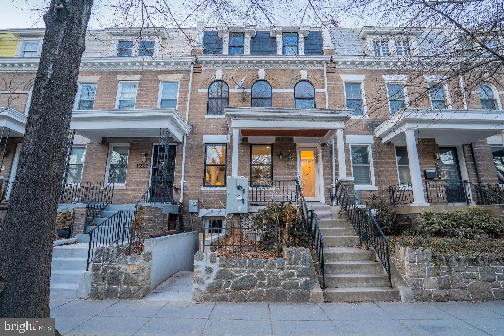 1225 Park Road Northwest, Unit 1 Washington, DC 20010 - Photo 38 of 38 a front view of a building with many windows