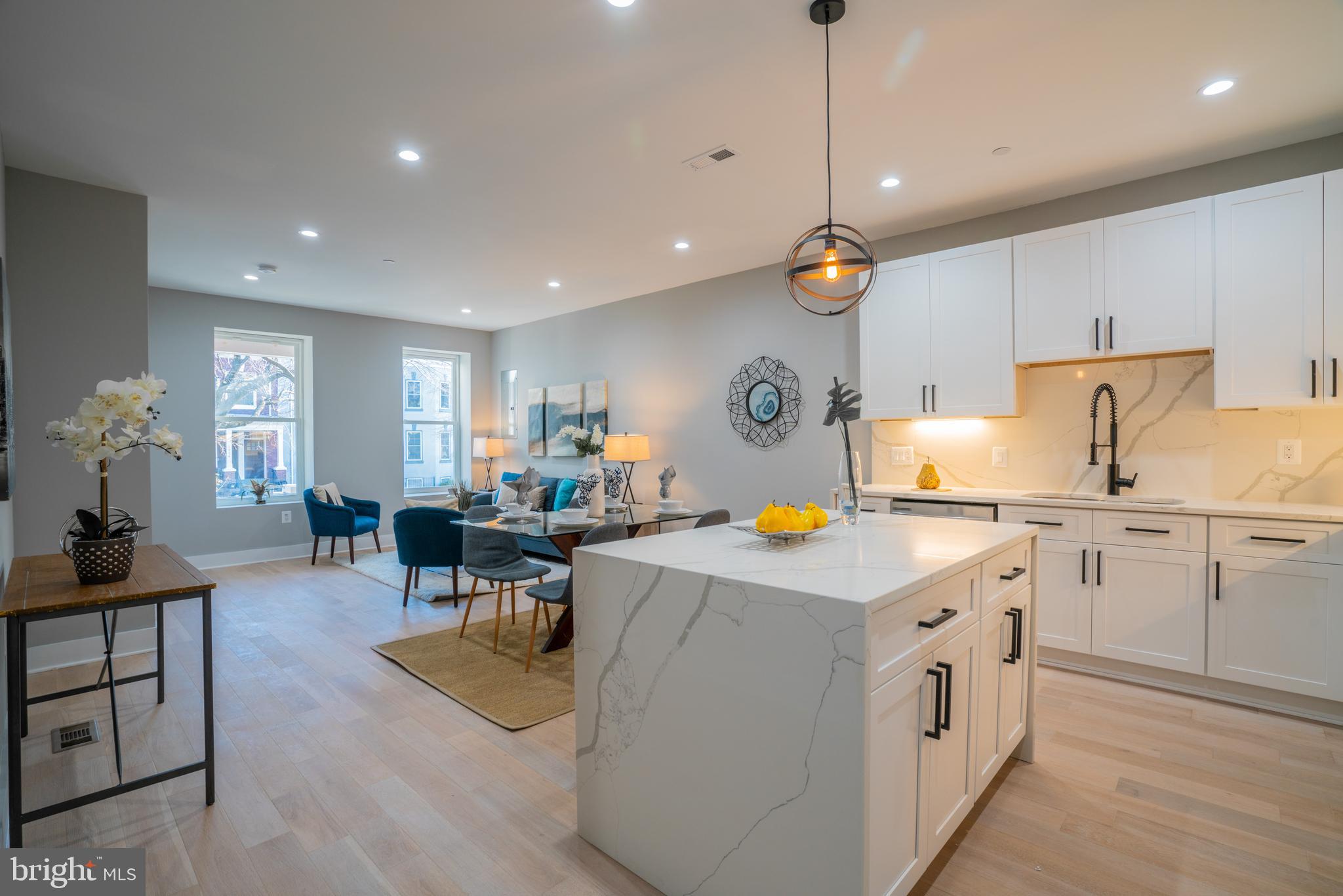 1225 Park Road Northwest, Unit 1 Washington, DC 20010 - Photo 5 of 38 a open kitchen with cabinets a sink and appliances