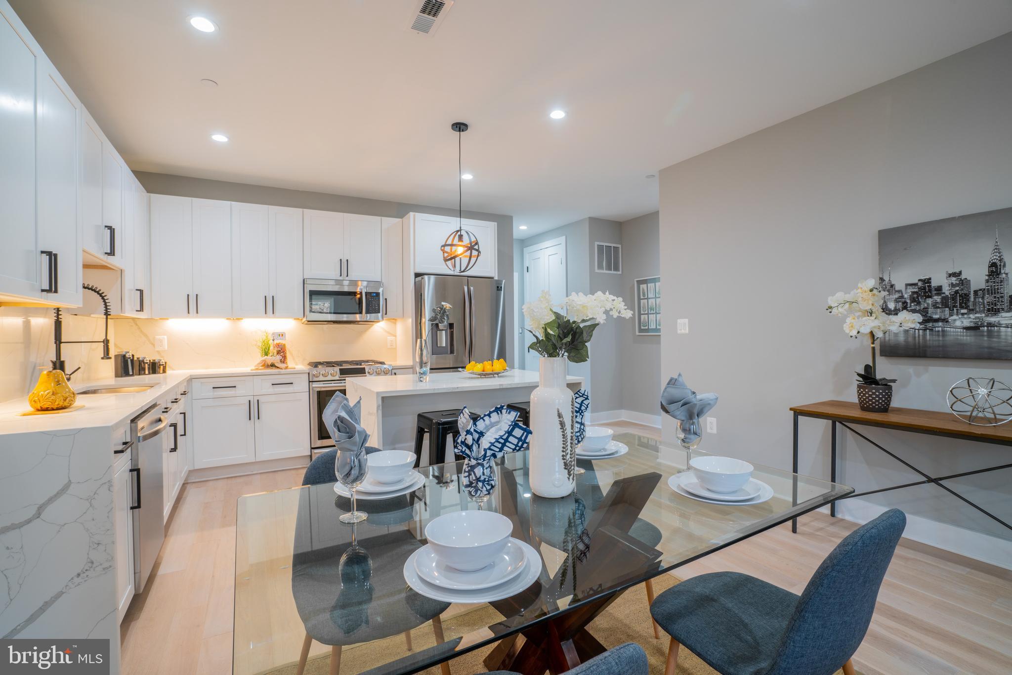 1225 Park Road Northwest, Unit 1 Washington, DC 20010 - Photo 7 of 38 a open dining room with furniture and wooden floor