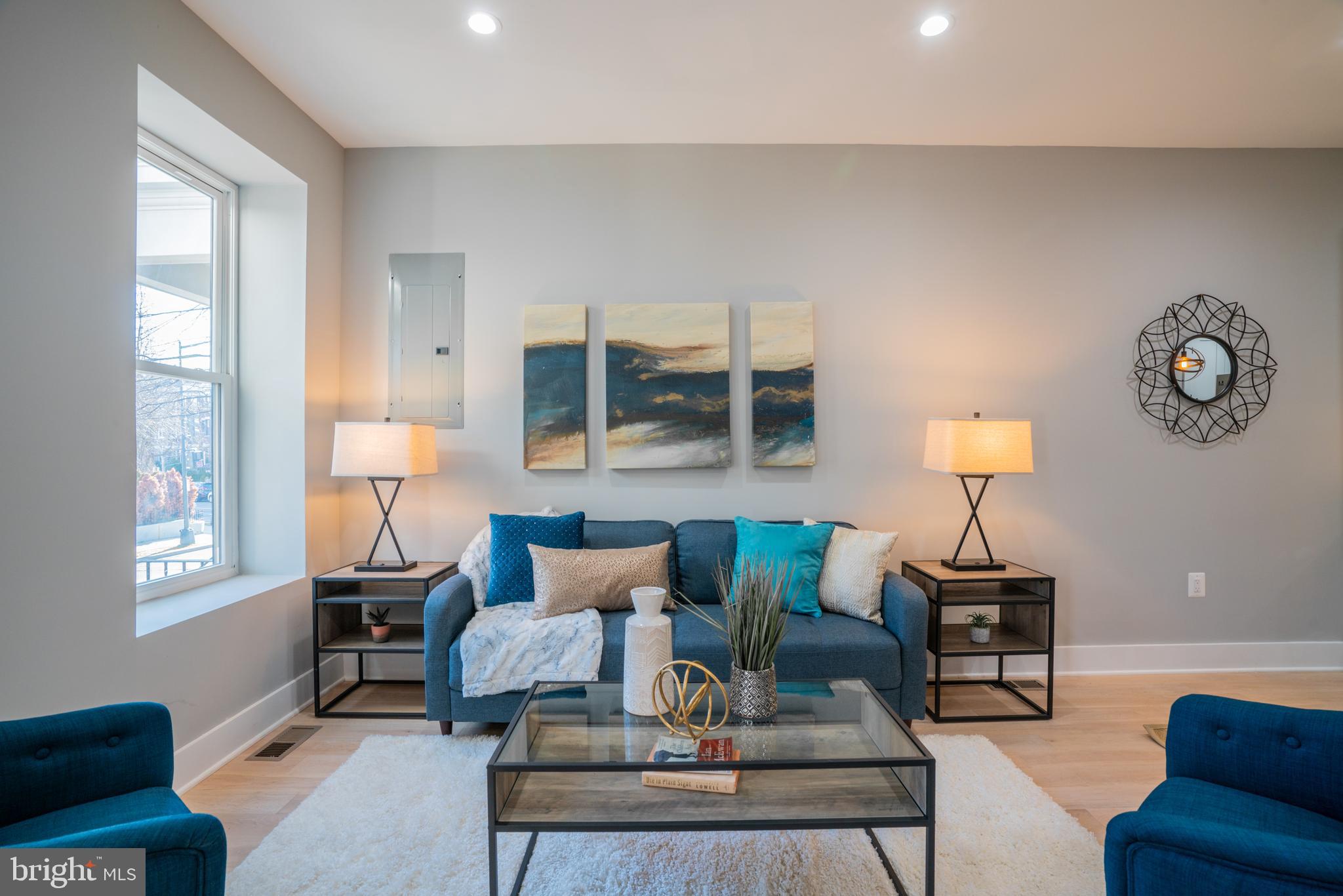 1225 Park Road Northwest, Unit 1 Washington, DC 20010 - Photo 8 of 38 a living room with furniture and a lamp