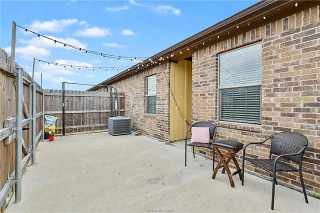 a view of a chairs and tables in the patio