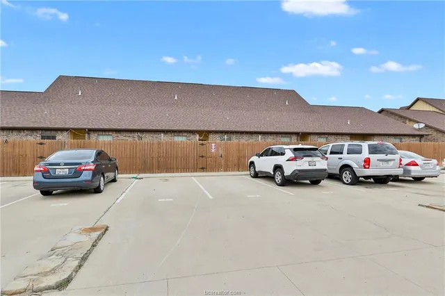 a view of a car parked in front of a house