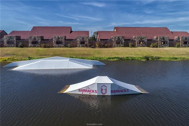 a view of a lake with a building in the background