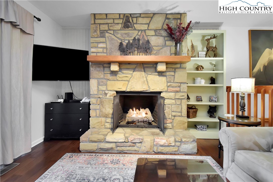 140 Manor View Lane, Unit CASCADES 2 Blowing Rock, NC 28605 - Photo 23 of 25 a living room with furniture and a fireplace