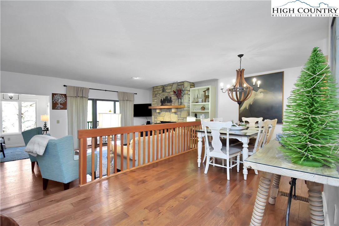 140 Manor View Lane, Unit CASCADES 2 Blowing Rock, NC 28605 - Photo 25 of 25 a dining room with furniture a rug and wooden floor