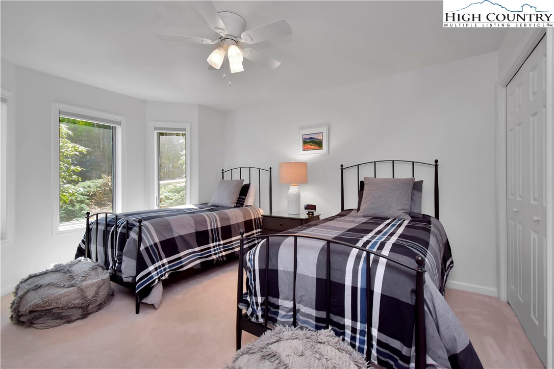 140 Manor View Lane, Unit CASCADES 2 Blowing Rock, NC 28605 - Photo 4 of 25 a bedroom with a bed and window