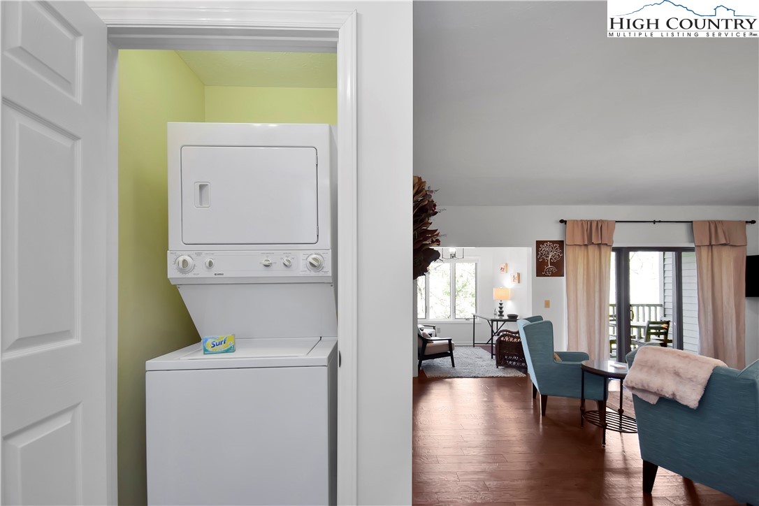 140 Manor View Lane, Unit CASCADES 2 Blowing Rock, NC 28605 - Photo 5 of 25 a view of living room with furniture and wooden floor