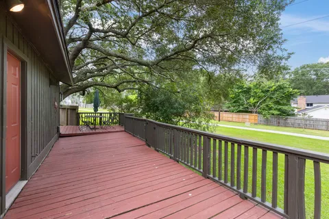 a view of balcony with wooden floor