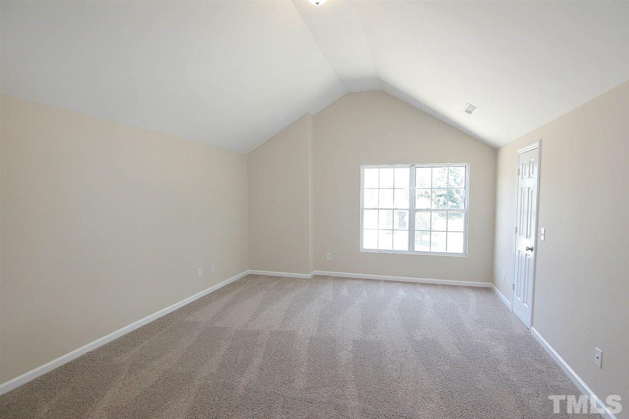 3715 Horseshoe Farm Street Raleigh, NC 27610 - Photo 12 of 18 an empty room with a window