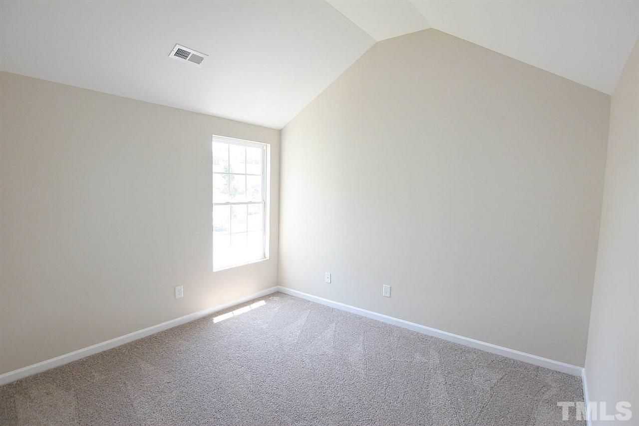 3715 Horseshoe Farm Street Raleigh, NC 27610 - Photo 16 of 18 an empty room with a window