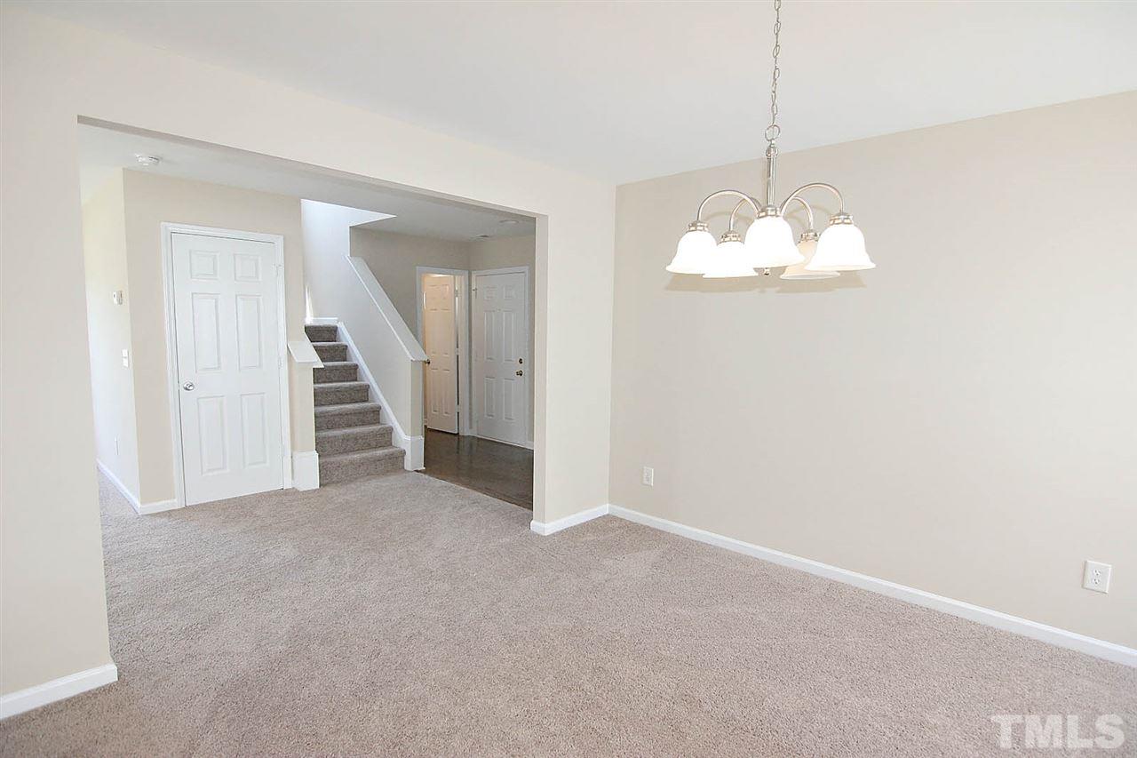 3715 Horseshoe Farm Street Raleigh, NC 27610 - Photo 5 of 18 a view of a chandelier in big room and chandelier fan