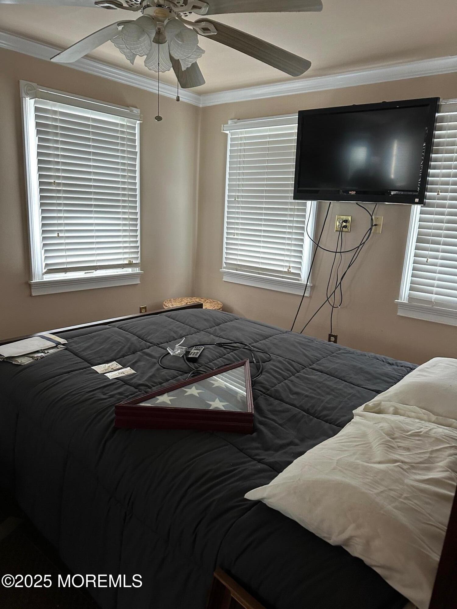 41 Frank Drive Beach Haven West, NJ 08050 - Photo 6 of 10 a bedroom with a bed and a flat screen tv