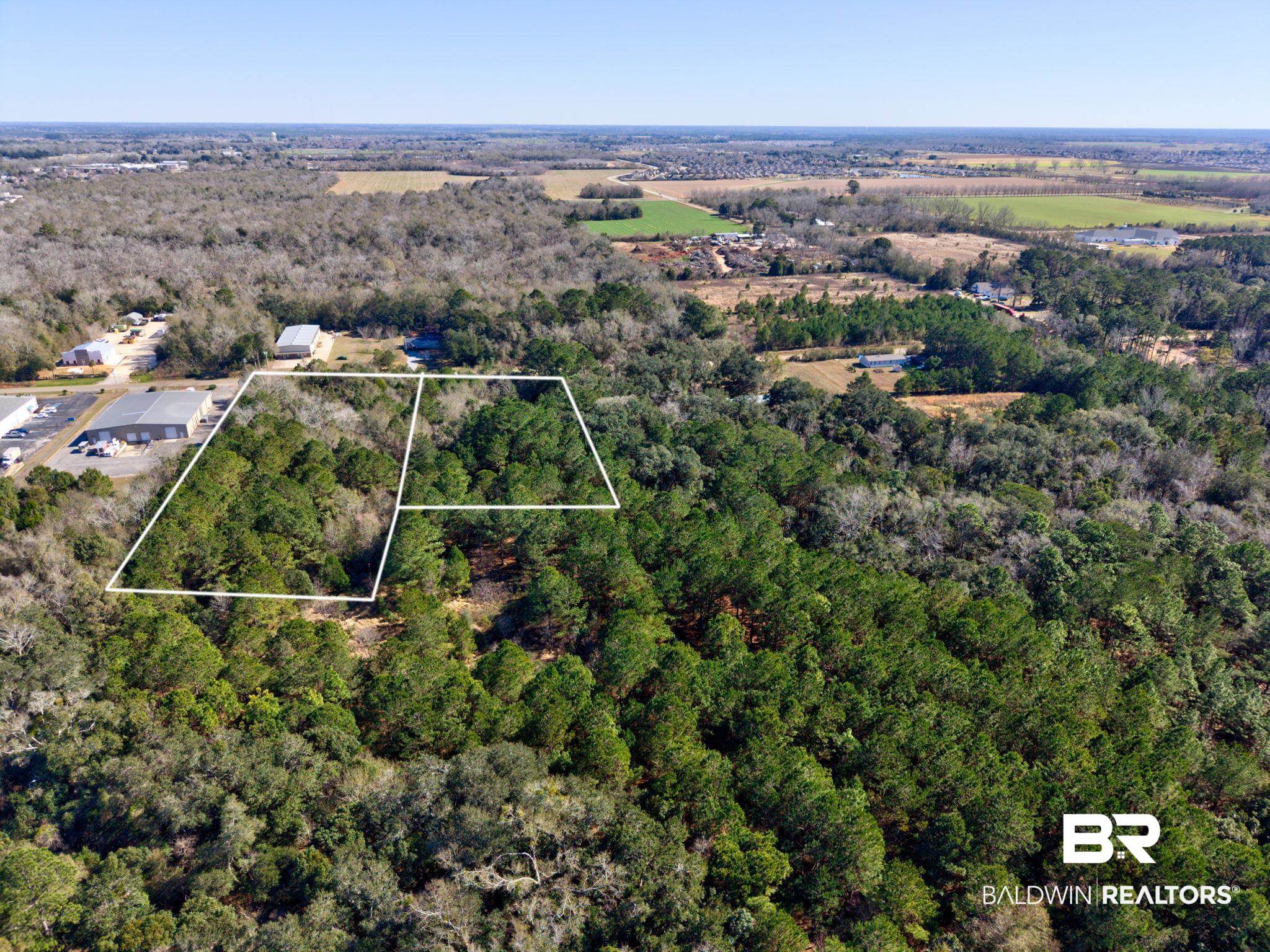 25280 Friendship Road Daphne, AL 36526 - Photo 7 of 34 Aerial overview of property's location with a heavily wooded area and property boundaries highlighted