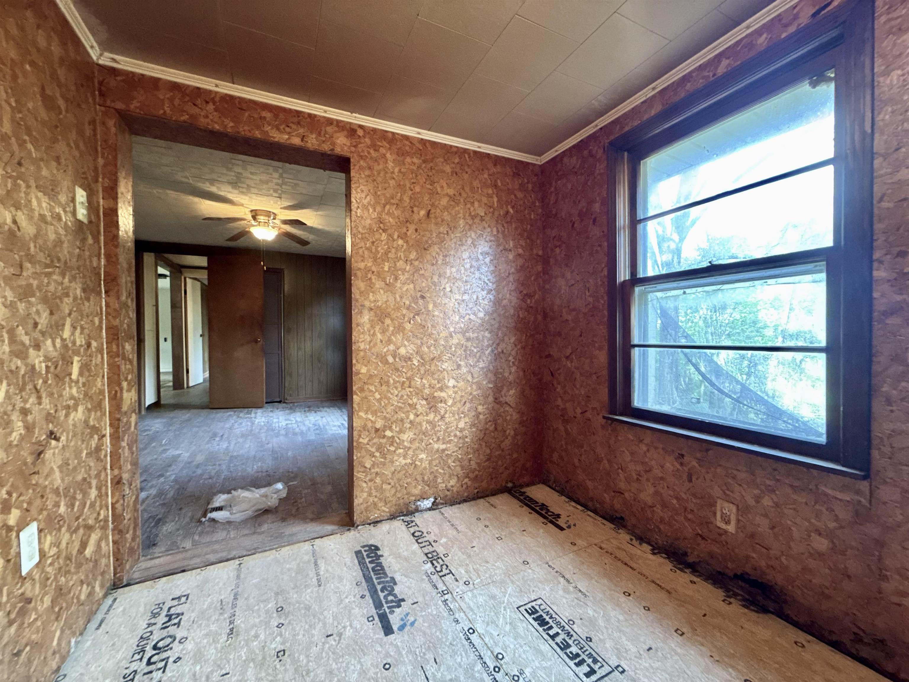 845 Needham Road Drummonds, TN 38023 - Photo 16 of 22 Spare room featuring ornamental molding and ceiling fan