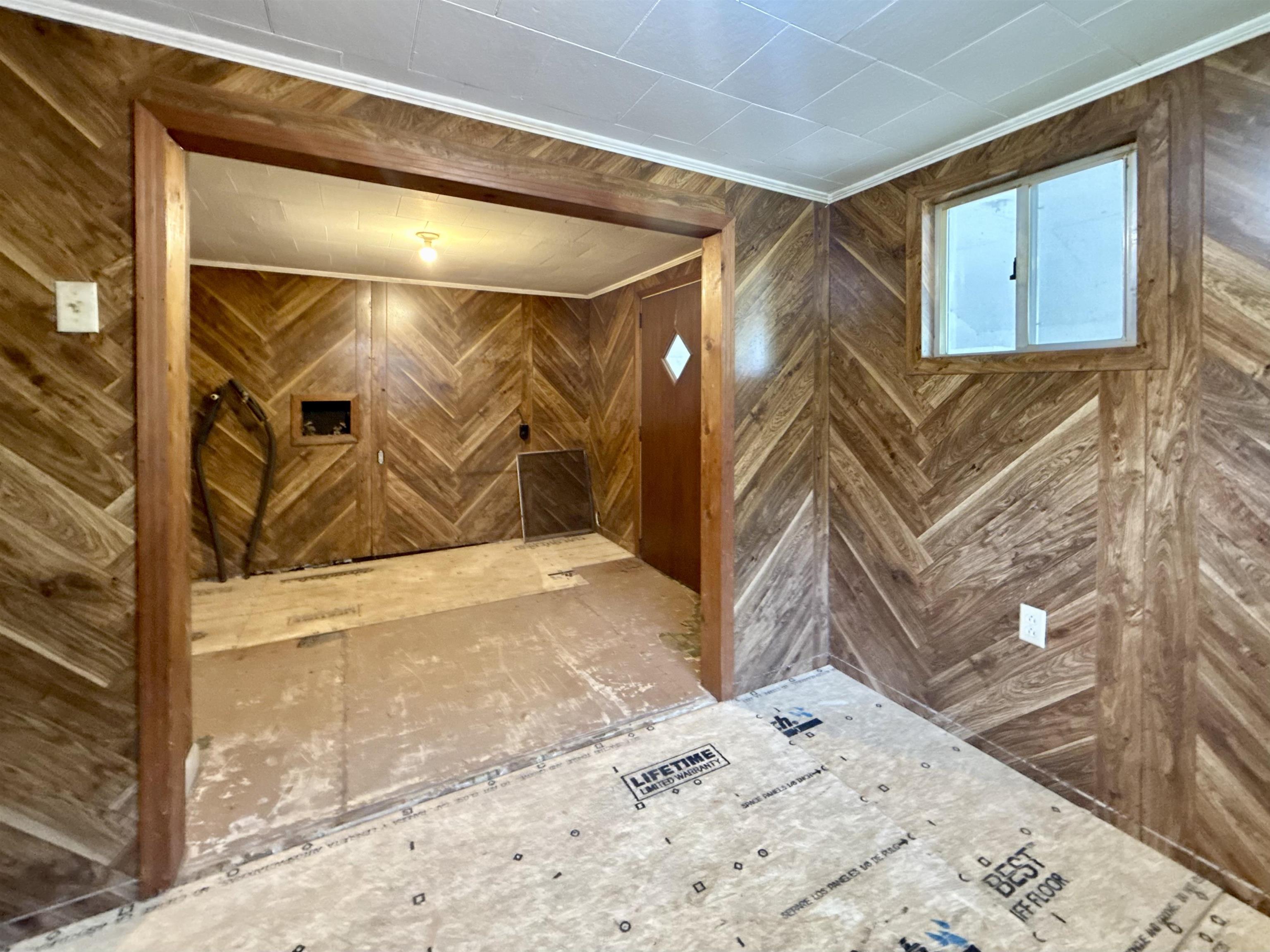 845 Needham Road Drummonds, TN 38023 - Photo 20 of 22 Interior space featuring wood walls