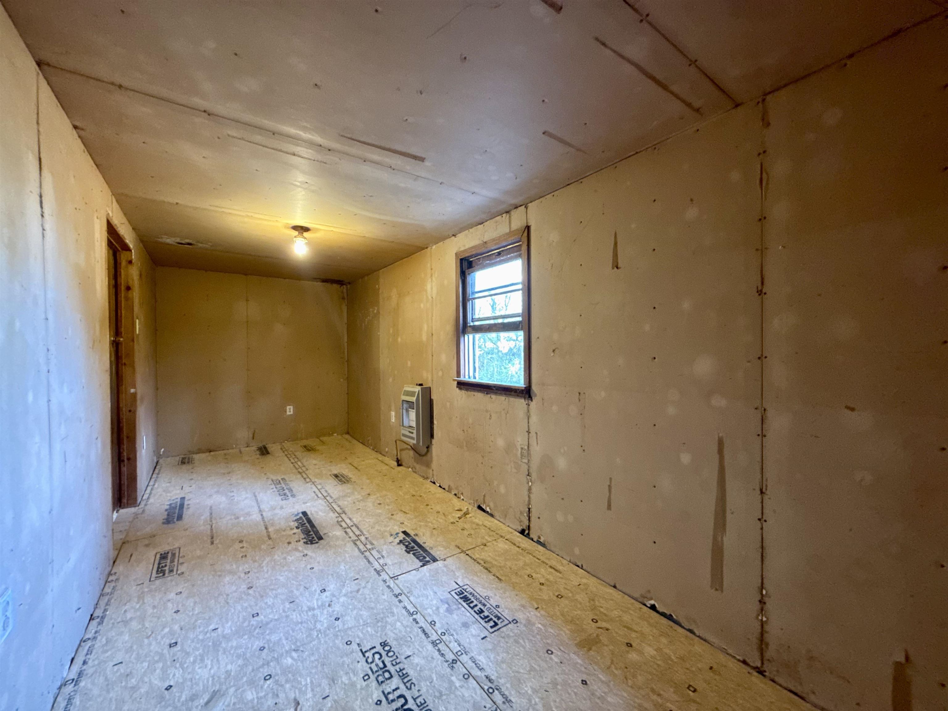 845 Needham Road Drummonds, TN 38023 - Photo 21 of 22 Empty room with heating unit
