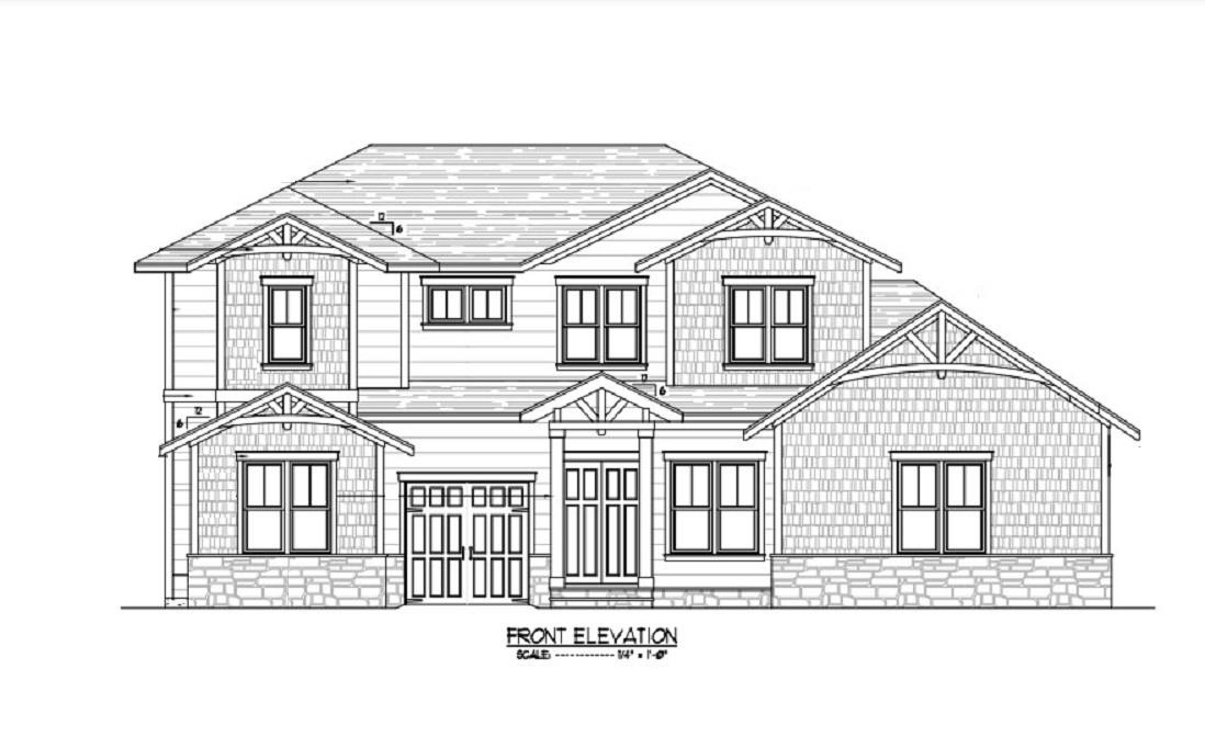 a view of a house with a small yard