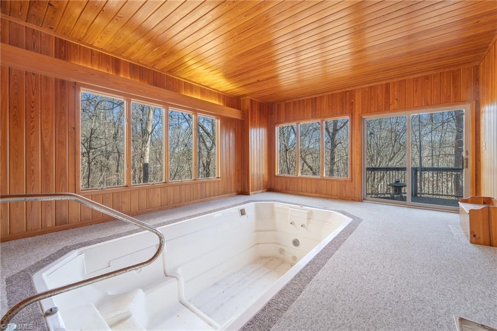 214 Hilton Road Stokesdale, NC 27357 - Photo 29 of 50 A heated, therapeutic lap pool is a very unique feature of this home.