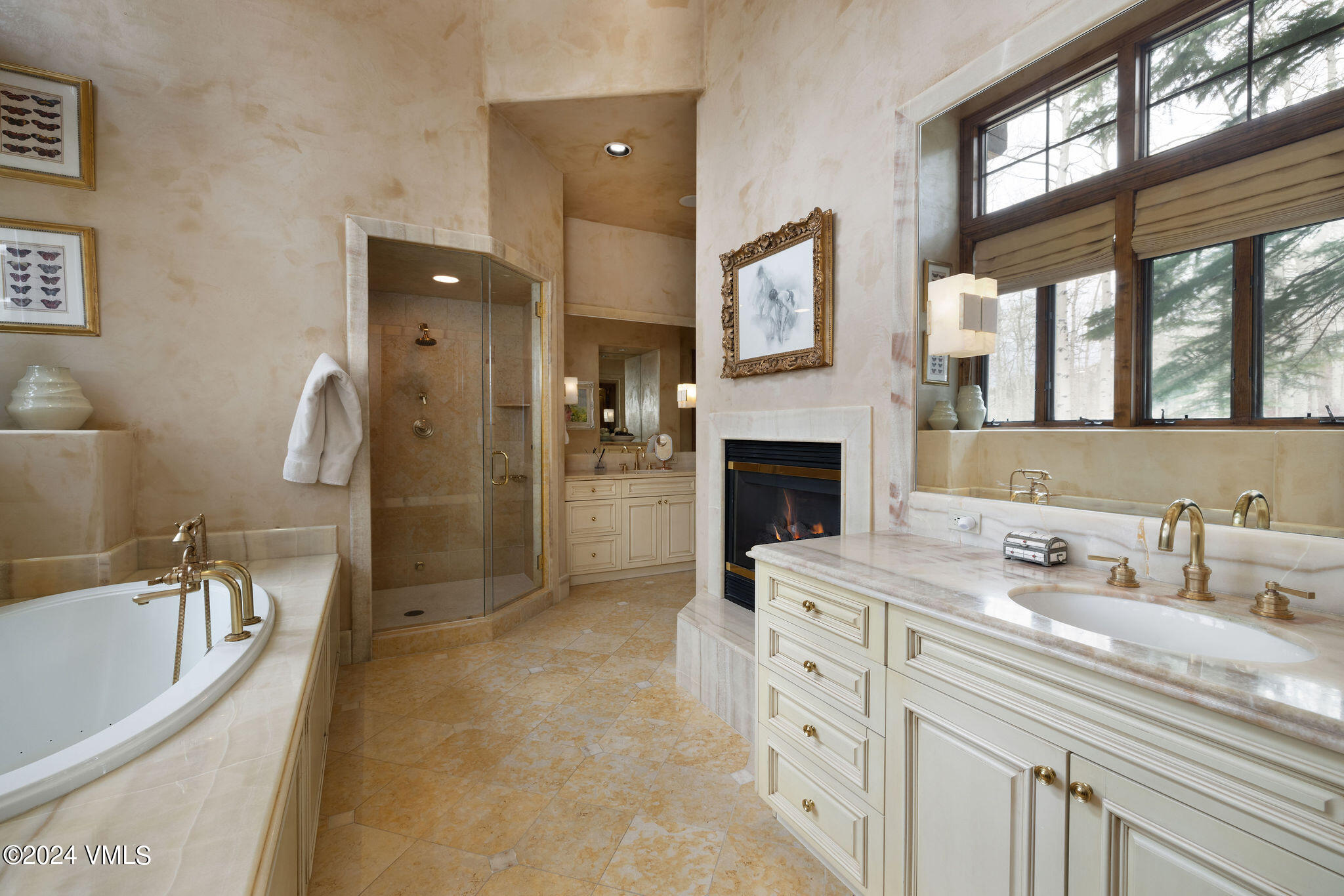 1101 Daybreak Ridge Road Avon, CO 81620 - Photo 12 of 30 a spacious bathroom with a sink double vanity and a bathtub