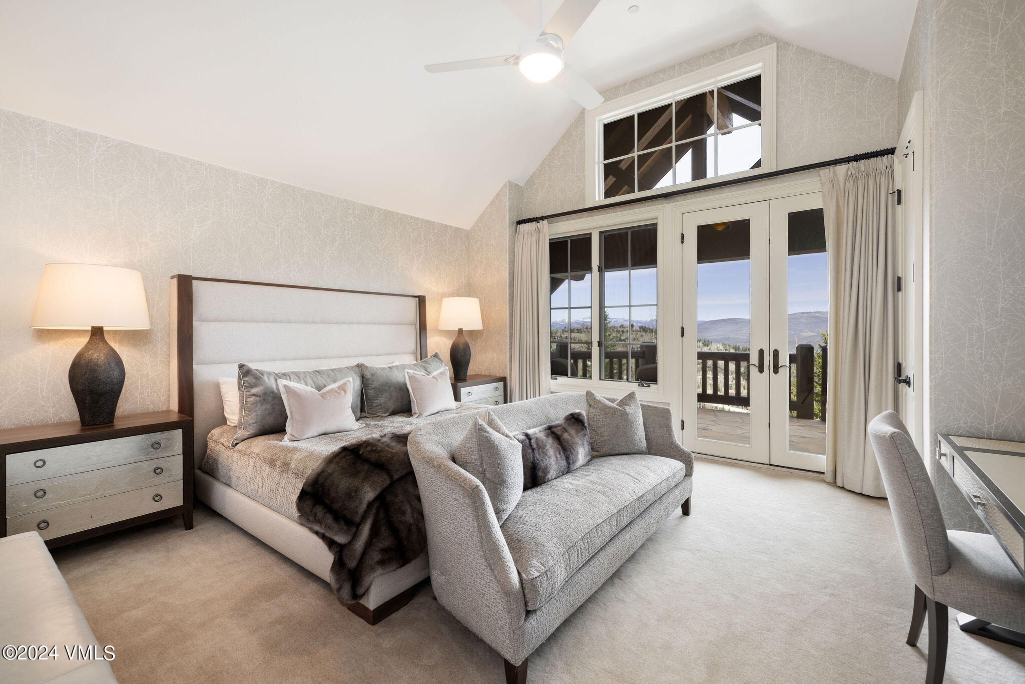 1101 Daybreak Ridge Road Avon, CO 81620 - Photo 17 of 30 a bedroom with furniture and a large window