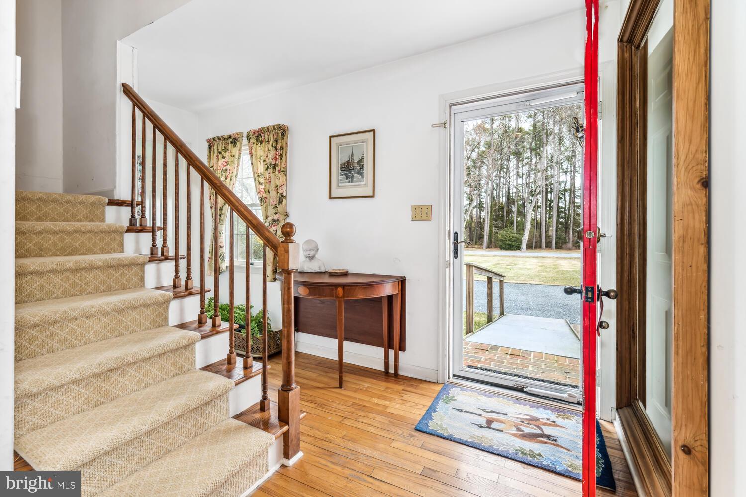 4260 Windrush Road Oxford, MD 21654 - Photo 21 of 39 a view of entryway and hall with wooden floor