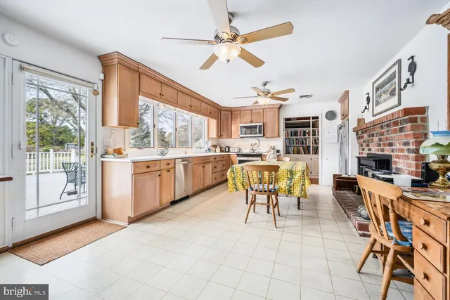 a view of a dining room with furniture and a table