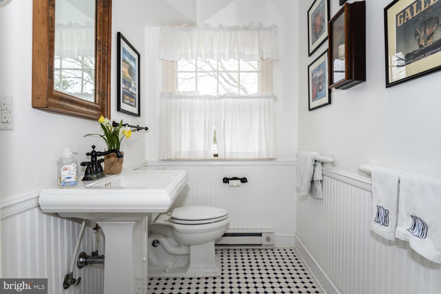 4260 Windrush Road Oxford, MD 21654 - Photo 28 of 39 a bathroom with a sink toilet and window
