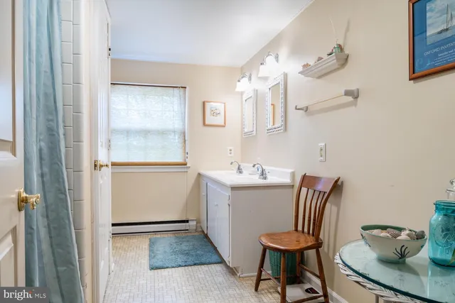 a view of a room with workspace and a window