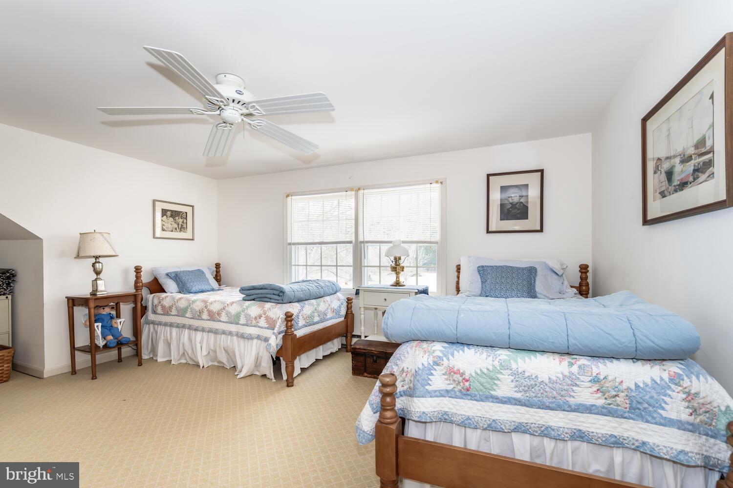 4260 Windrush Road Oxford, MD 21654 - Photo 35 of 39 a bedroom with a bed couch and window