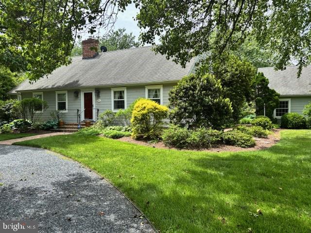 4260 Windrush Road Oxford, MD 21654 - Photo 10 of 39 a front view of a house with a yard and trees
