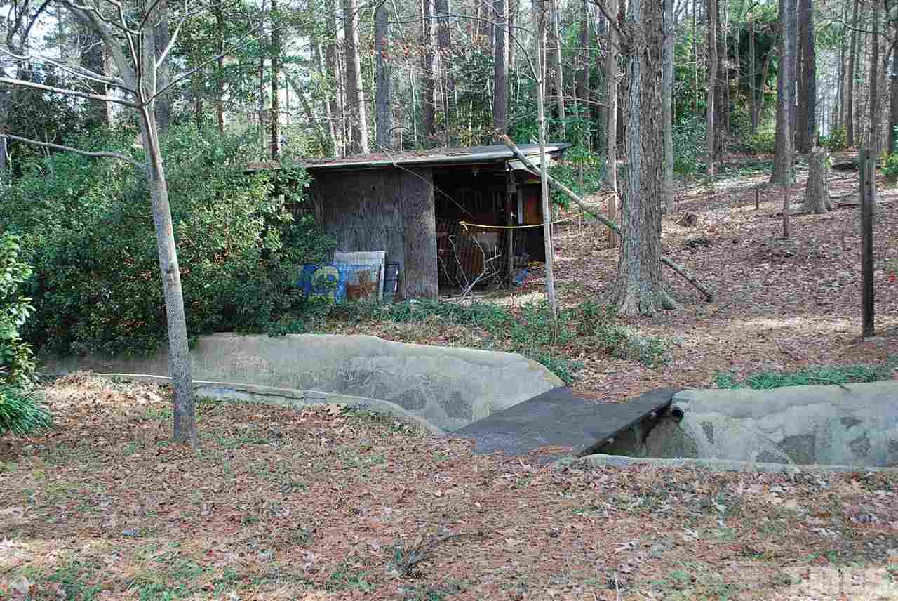 1920 Trawick Road Raleigh, NC 27604 - Photo 22 of 25 a view of a wooden deck with a yard