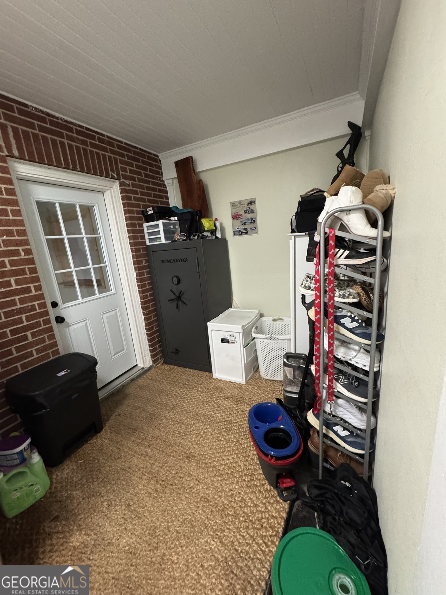 107 Springdale Drive Thomaston, GA 30286 - Photo 11 of 30 a living room with furniture gym equipment and a mirror