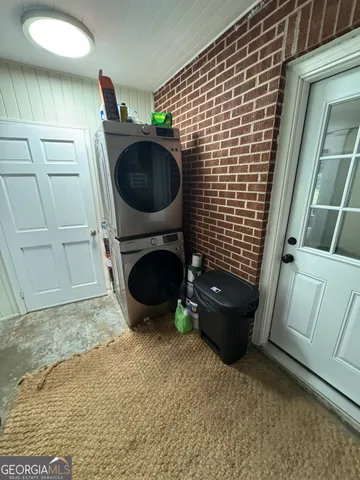 a kitchen with stainless steel appliances granite countertop a sink and a stove