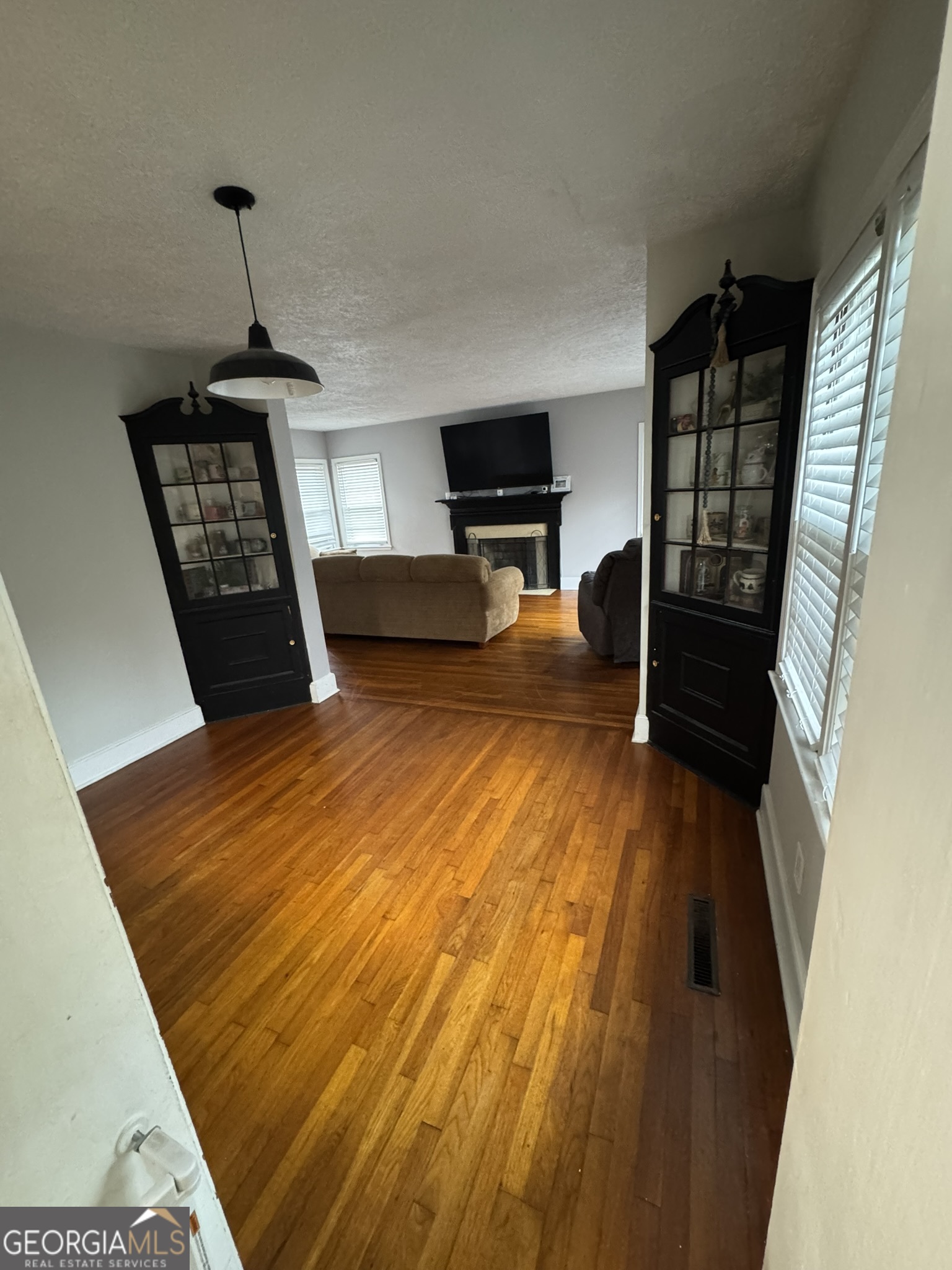 107 Springdale Drive Thomaston, GA 30286 - Photo 17 of 30 a bedroom with a bed window and a flat screen tv