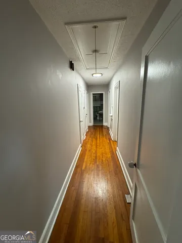 a bedroom with furniture and a wooden floor