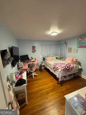 a bathroom with a sink toilet and mirror