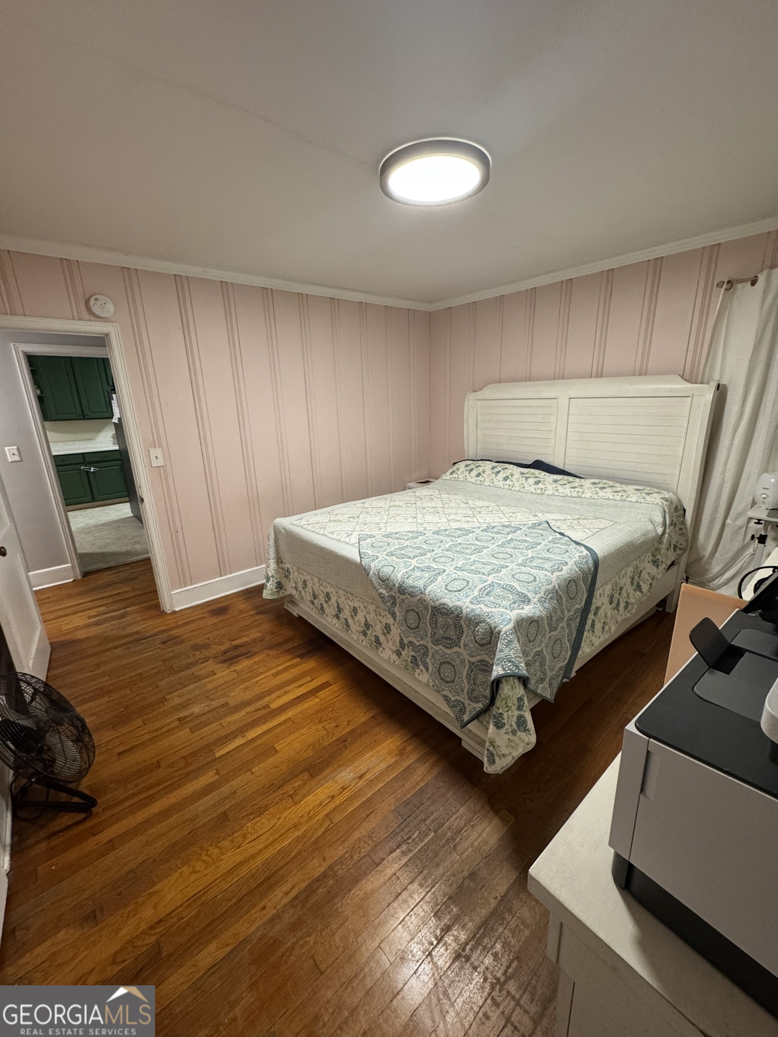 107 Springdale Drive Thomaston, GA 30286 - Photo 28 of 30 a spacious bedroom with a bed and a flat screen tv