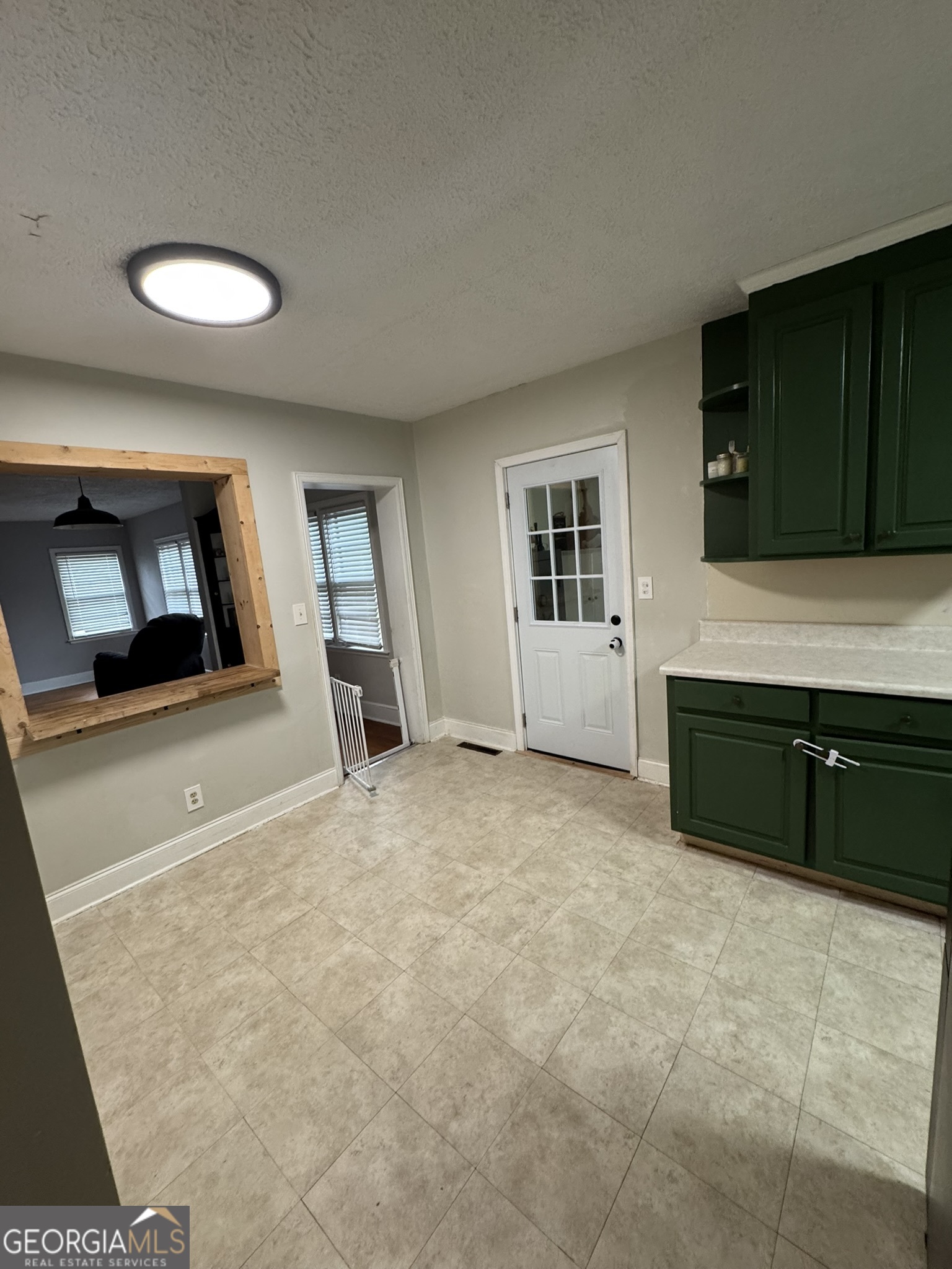 107 Springdale Drive Thomaston, GA 30286 - Photo 30 of 30 a living room with a fireplace and a flat screen tv