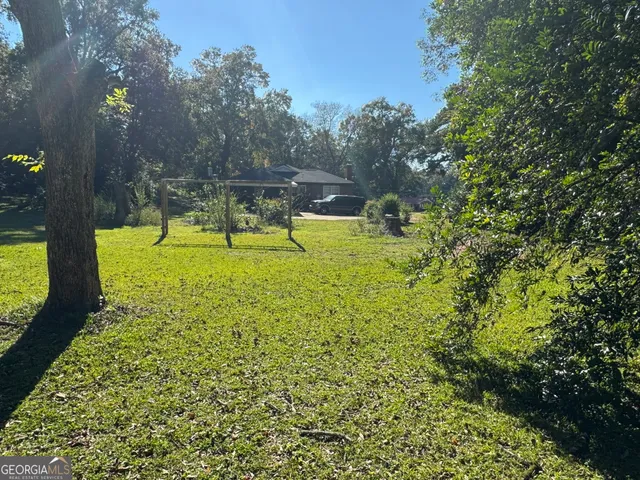 a view of swimming pool with a yard