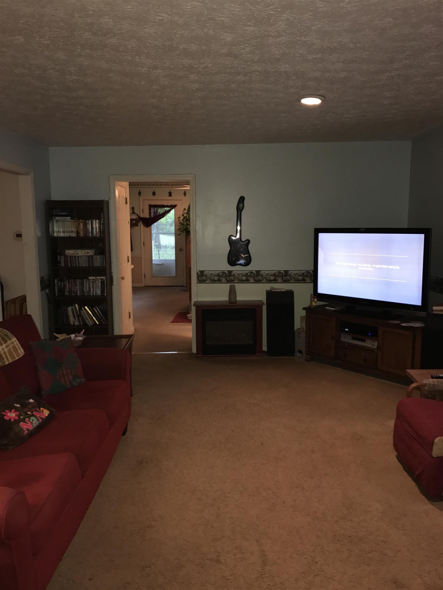 3710 Baggett Road Springfield, TN 37172 - Photo 11 of 16 a living room with furniture and a flat screen tv