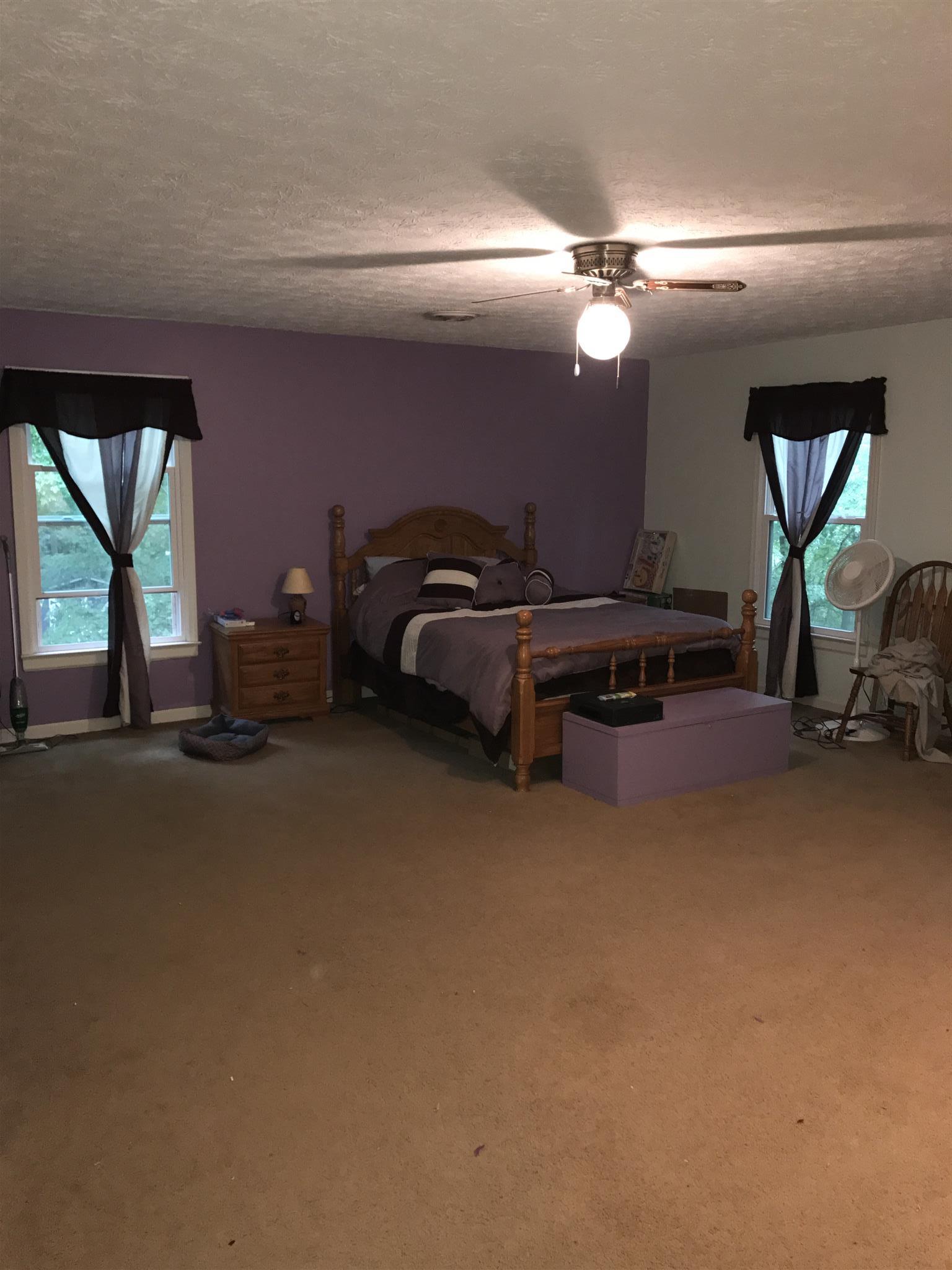 3710 Baggett Road Springfield, TN 37172 - Photo 3 of 16 a bed room with furniture and a chandelier