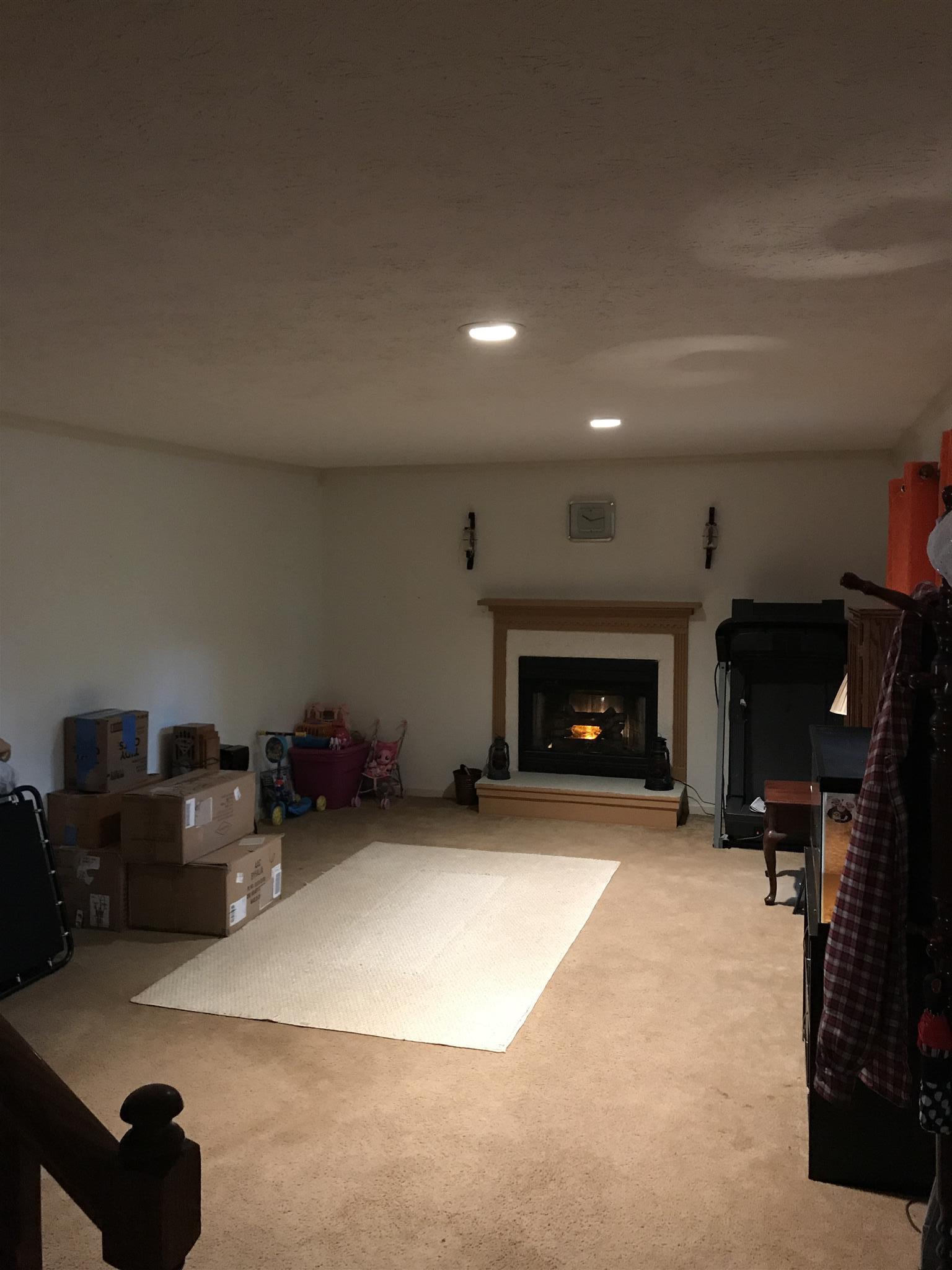 3710 Baggett Road Springfield, TN 37172 - Photo 8 of 16 a view of an empty room with furniture and a fireplace