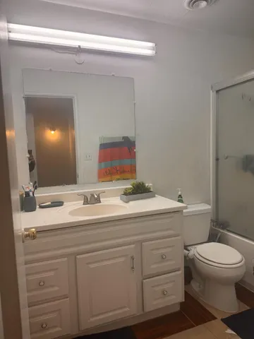 view of room with stairs and a wooden walls