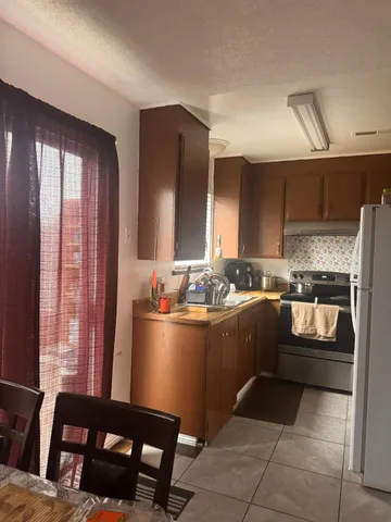 a living room with a couch and a rug