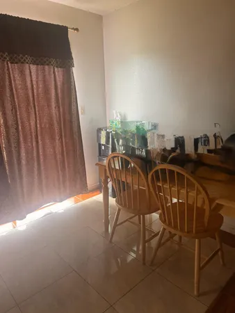 a view of a chairs and table in the terrace