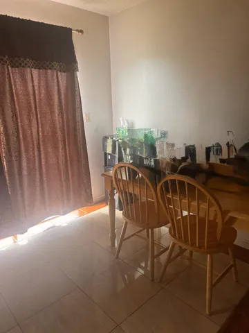 a view of a chairs and table in the terrace