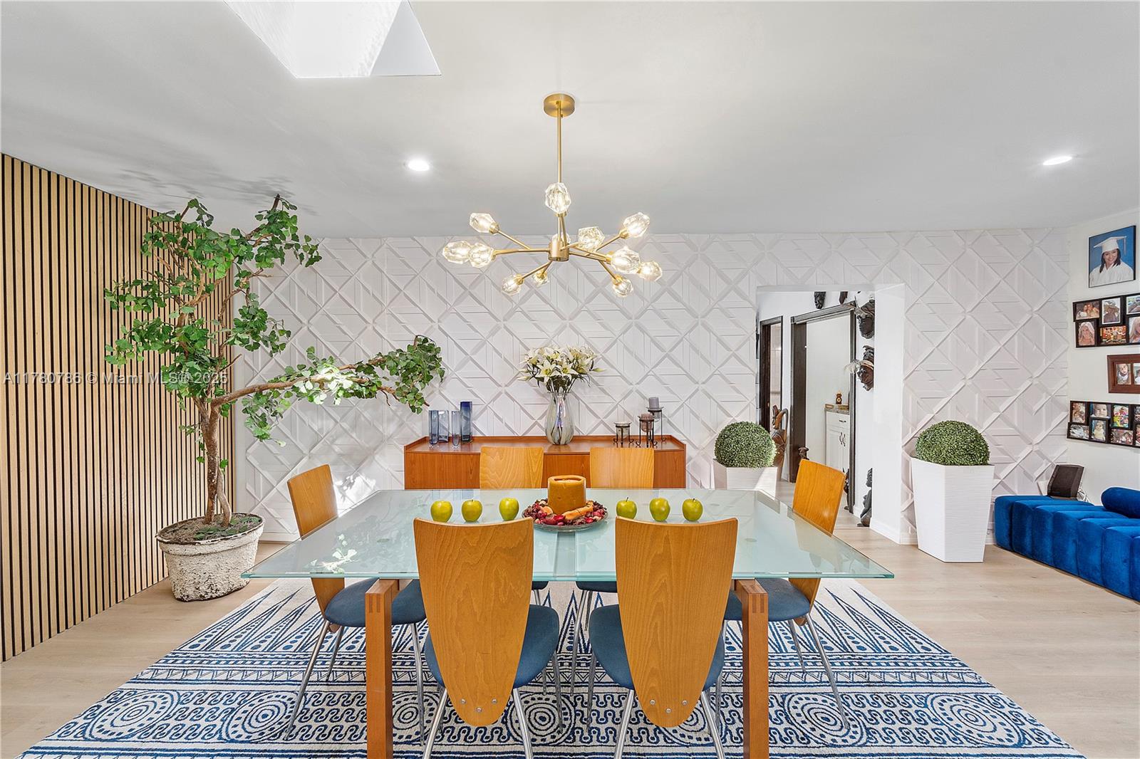 12555 Southwest 31st Street Miami, FL 33175 - Photo 16 of 47 a view of a dining room with furniture and chandelier
